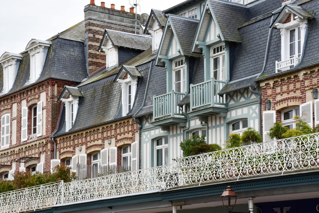 Historic Normandy houses in Deauville, featuring ornate exteriors and classic French charm.