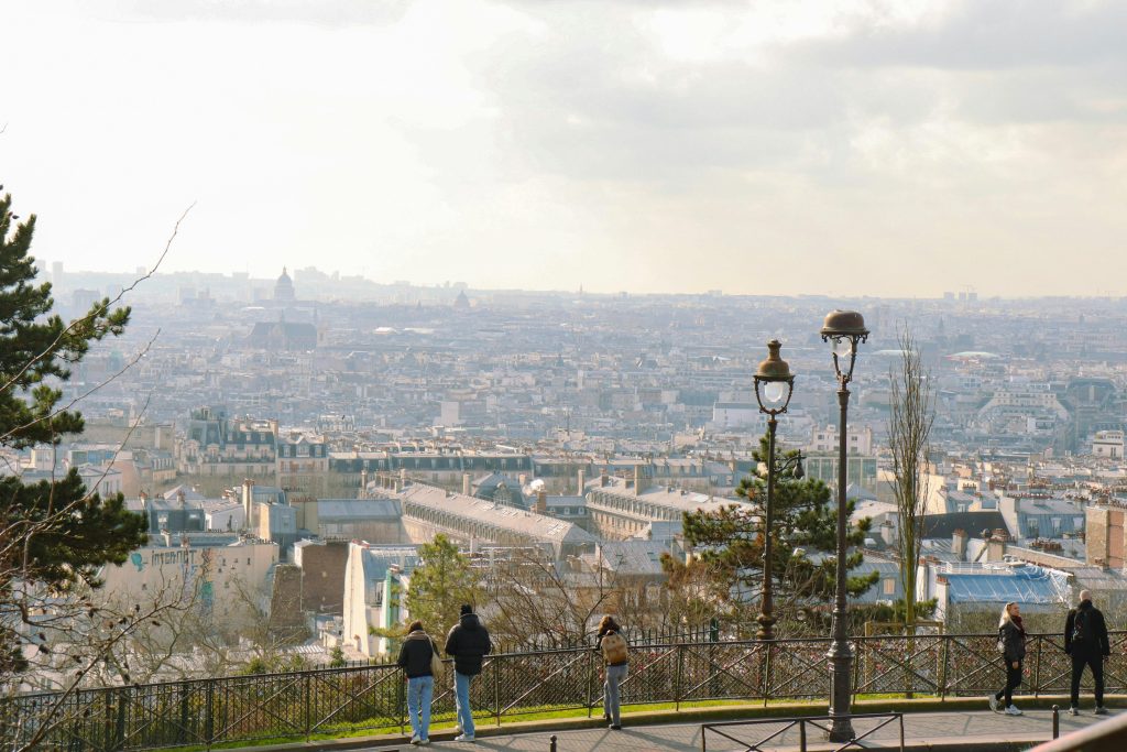 Enjoy a panoramic view of Paris skyline from Montmartre, showcasing urban charm.