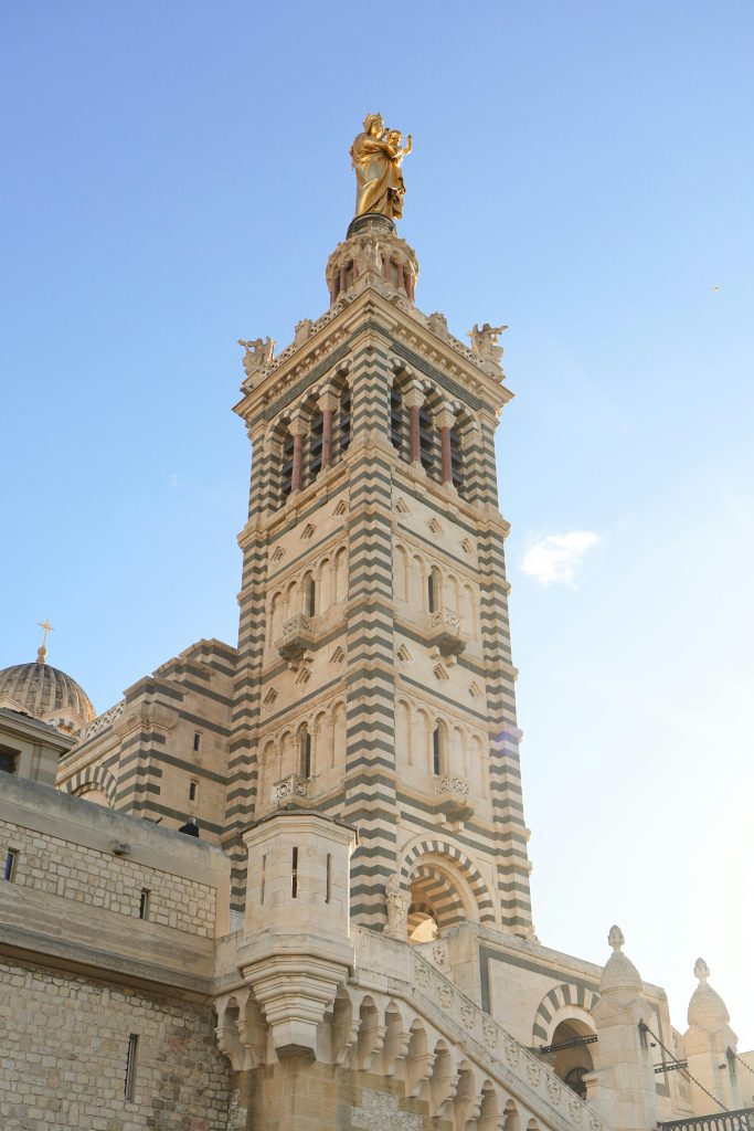Stunning view of Notre-Dame de la Garde Basilica in Marseille with clear blue sky.
