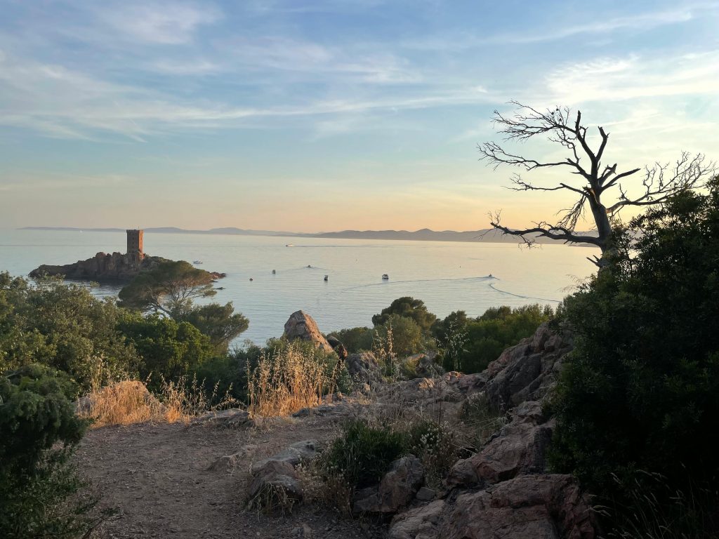 Stunning sunset over the Dramont coastline with sea and island views in Provence, France.
