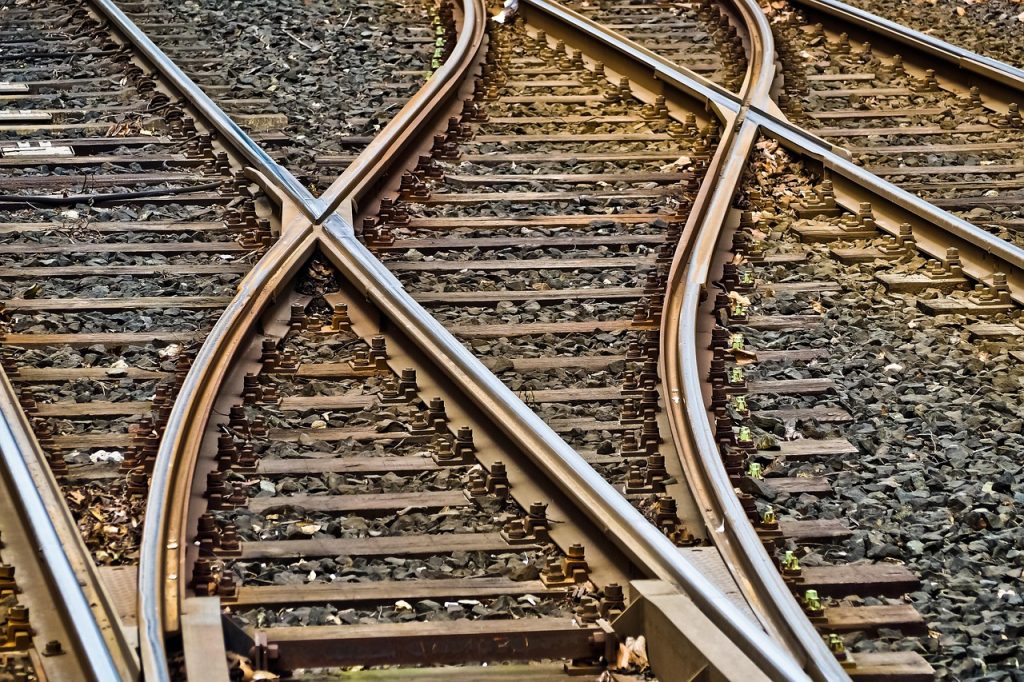 French railway tracks curving away into the distance
