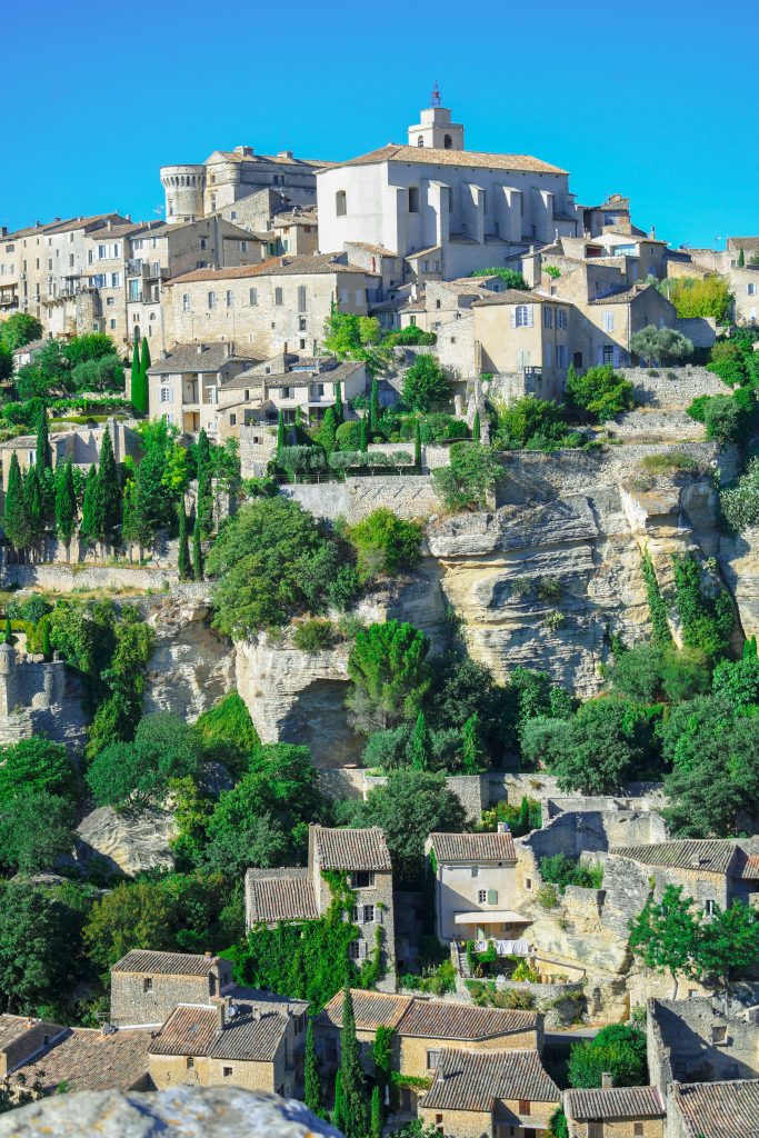 Gordes perched on its cliff in Provence, the kind of village that deserves three nights rather than three hours